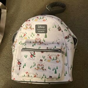 Loungefly Disney Holiday mini backpack a bit used still is in good shape.